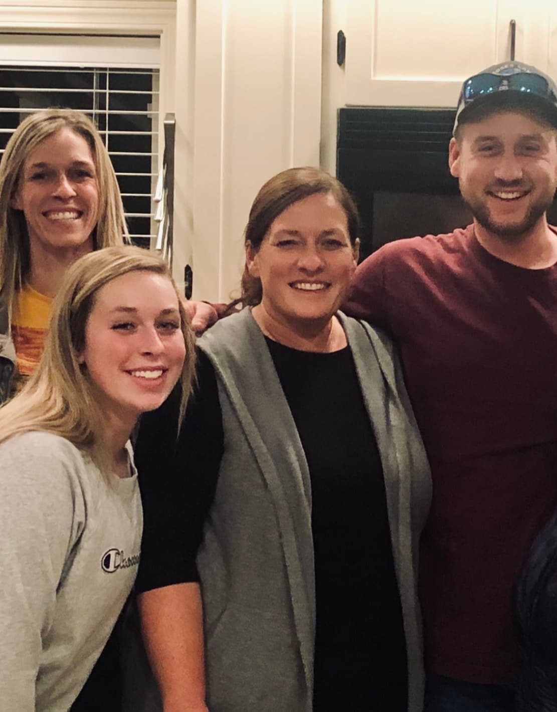 Darci with family indoors