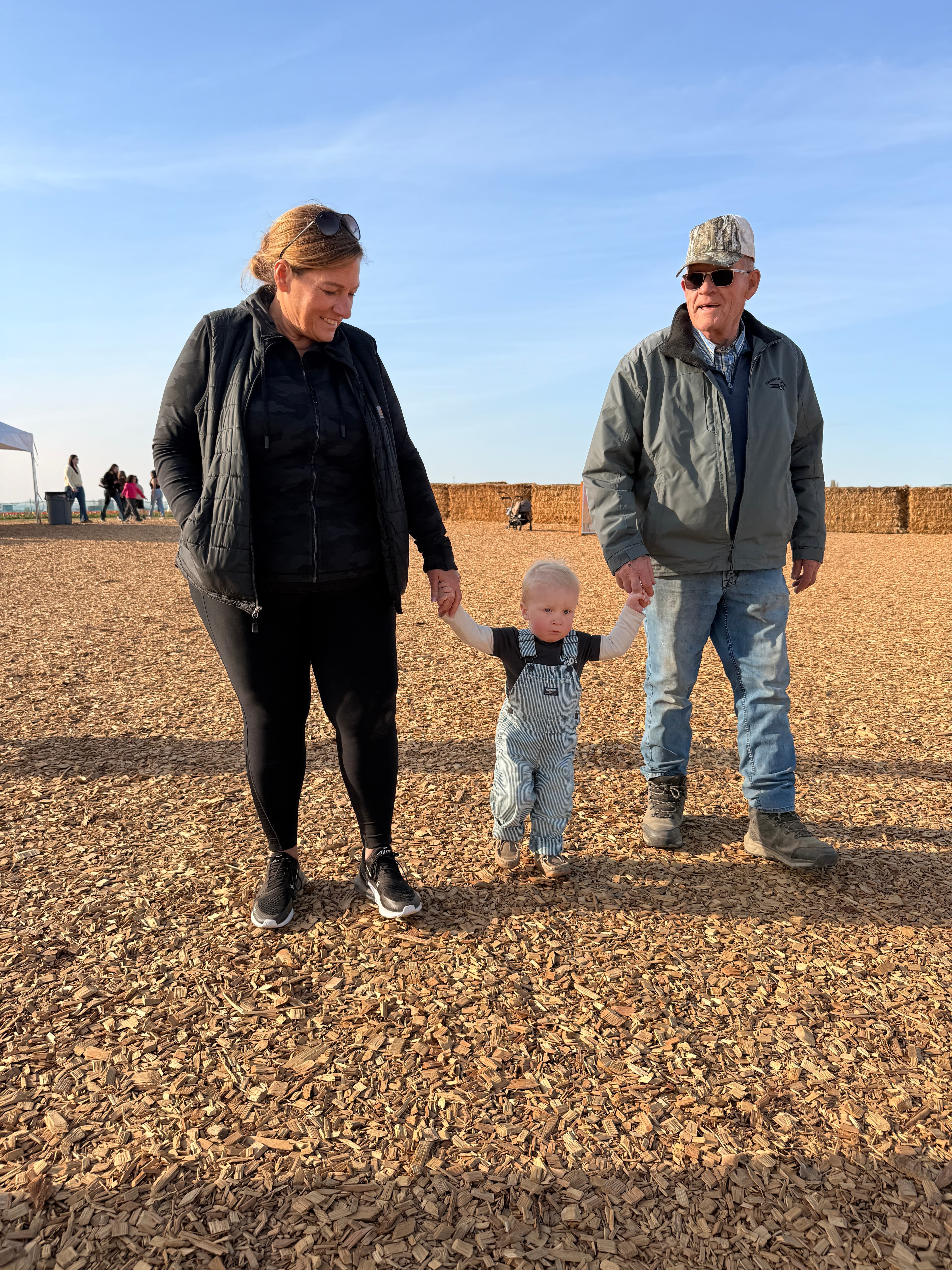 Darci at a pumpkin patch with family